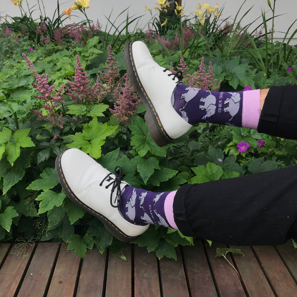 A pair of purple elephant patterned Bare Kind socks with white brogues 