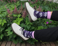 A pair of purple elephant patterned Bare Kind socks with white brogues 