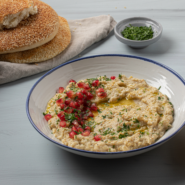 A bowl of hummus created using Med Cuisine products 