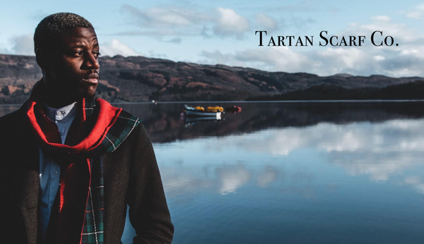 Tartan Scarf Co  - man wearing a tartan scarf over looking a lake