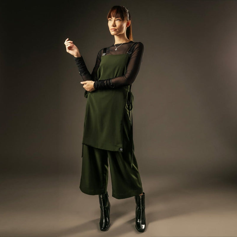 Black long sleeve mesh top with green pinafore dress out of sync