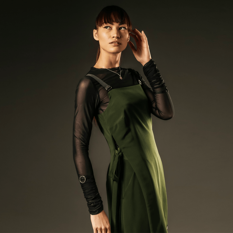 green pinafore dress with black long sleeve mesh top out of sync 