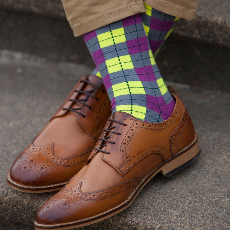 Man wearing brown shoes and Peper Harow neon checkmate men's luxury socks